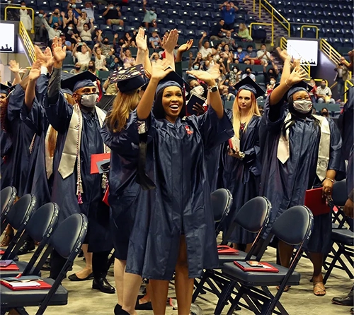 Hodges graduates smiling at their ceremony