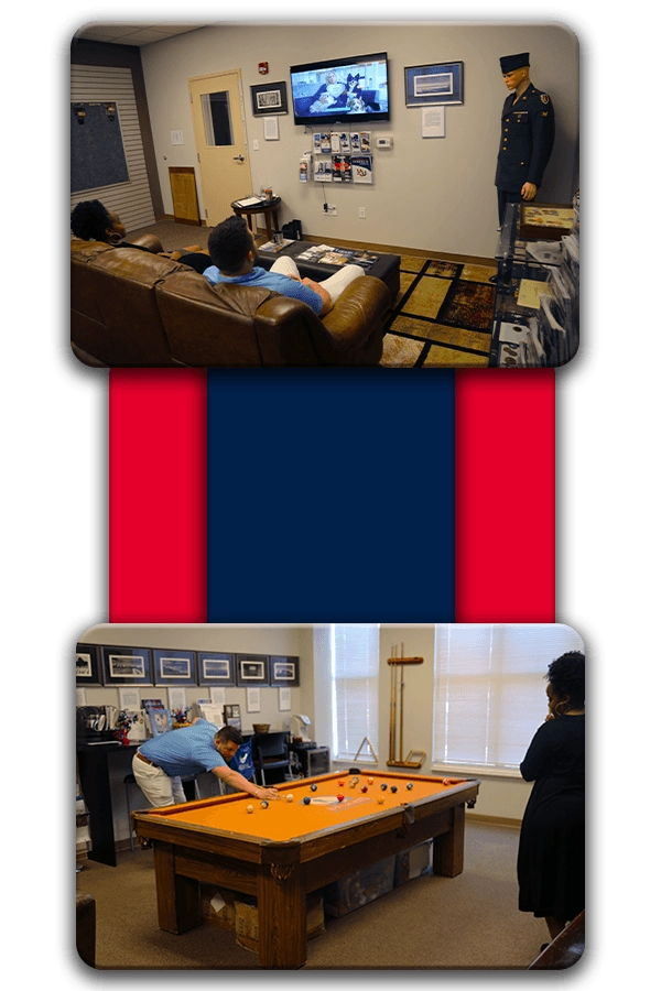 Veterans playing pool in the veteran service center at Hodges University