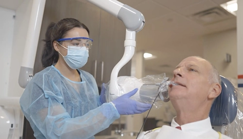 Hodges Dental Hygiene student working with a patient at the Hodges University Dental Hygiene Clinic