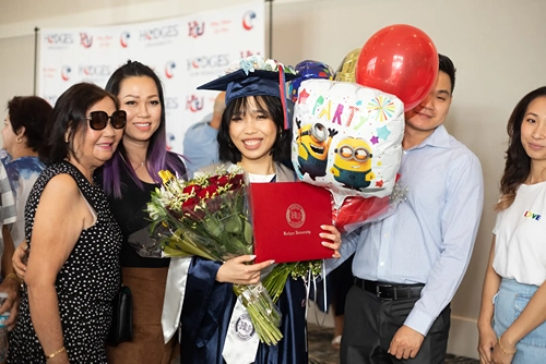 Happy graduates from Hodges University while at graduation