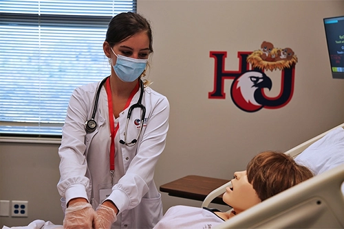 Bursing student working in the nursing lab at Hodges University