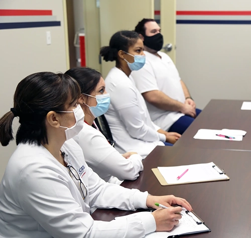 Hodges University Nursing students taking notes in class